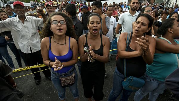 Manifestantes protestam contra situação econômica da Venezuela em Caracas - Sputnik Brasil
