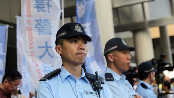 Polícia chinesa patrulhando cidade - Sputnik Brasil