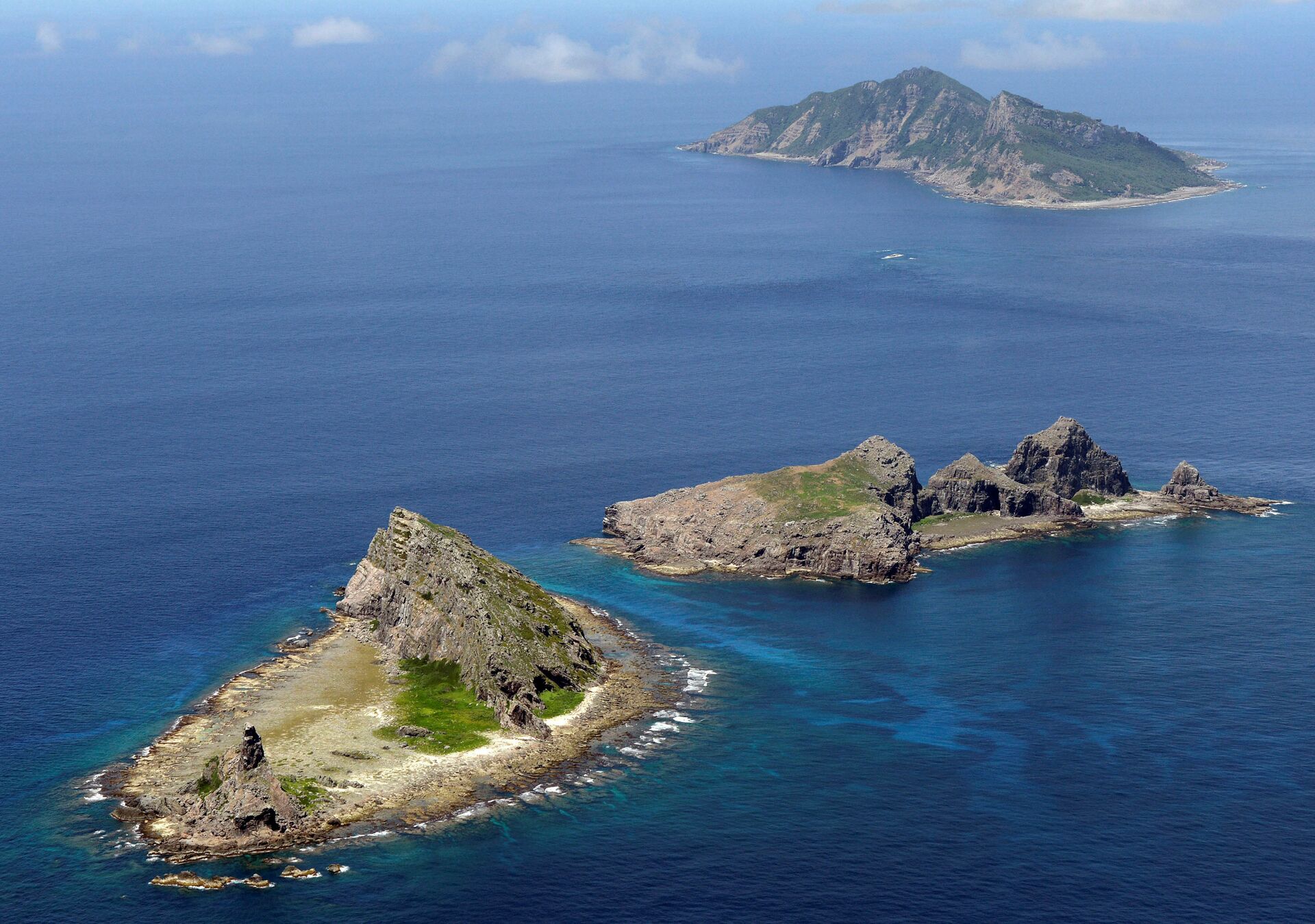 Grupo de ilhas disputadas no mar do Sul da China: Uotsuri, Minamikojima e Kitakojima denominados Senkaku no Japão e Diaoyu na China (foto de arquivo) - Sputnik Brasil, 1920, 27.12.2021