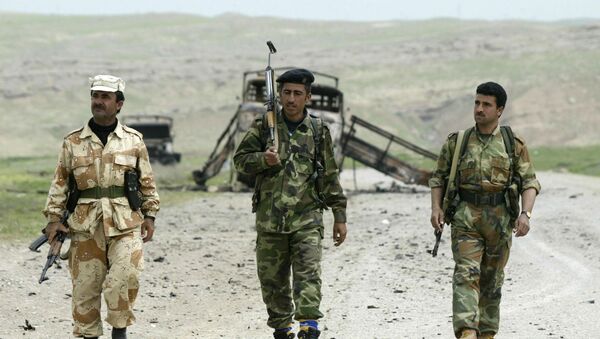 Combatentes de Peshmerga, forças  do Curdistão iraquiano após o combate de dois dias a 15 quilômetros da cidade de Mossul, Iraque - Sputnik Brasil