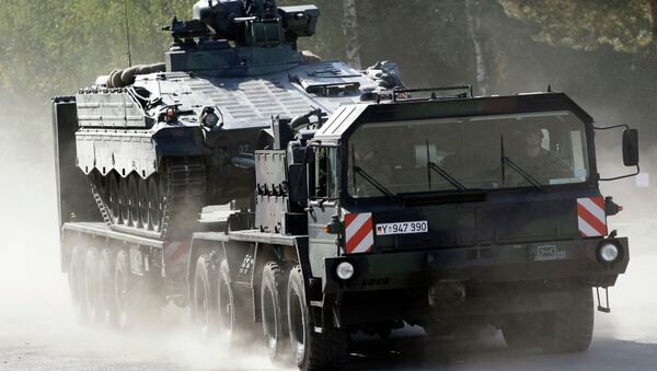  A transportation truck carries an armoured transport vehicle during a demonstration event held for the media by the German Bundeswehr. - Sputnik Brasil