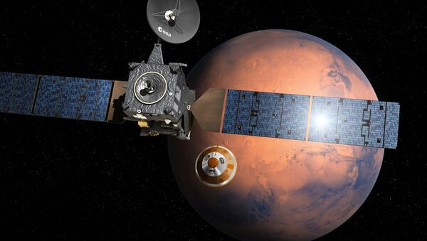 O aparelho Trace Gas Orbiter (TGO) lança a sonda Schiaparelli no âmbito do projeto ExoMars. Representação artística - Sputnik Brasil