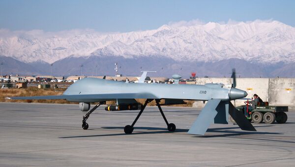 US Predator unmanned drone armed with a missile setting off from its hangar at Bagram air base in Afghanistan, November 27, 2009. - Sputnik Brasil