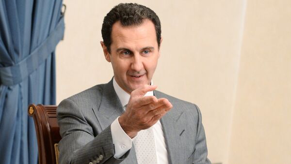 Presidente da Síria, Bashar Assad, visto durante uma visita do vice-primeiro-ministro russo, Dmitry Rogozin, a Damasco - Sputnik Brasil