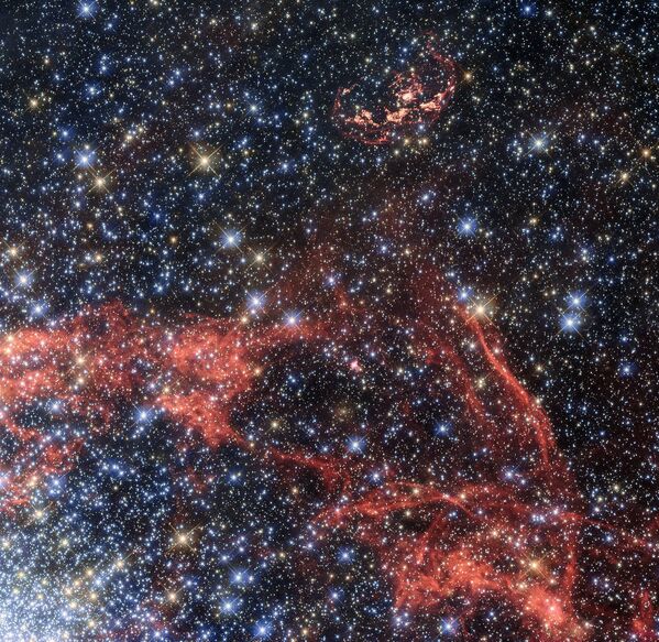 O telescópio espacial Hubble fotografa os vestígios da supernova N103B, que estão localizados a 160.000 anos-luz da Terra, na galáxia da Grande Nuvem de Magalhães - Sputnik Brasil
