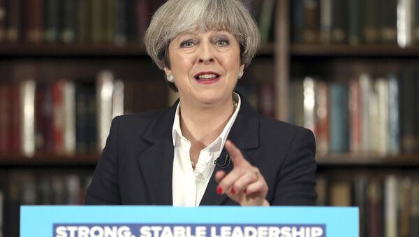 Britain's Prime Minister Theresa May makes a speech at the Royal United Services Institute for Defence and Security Studies in central London while on the General Election campaign trail. Monday June 5, 2017. - Sputnik Brasil