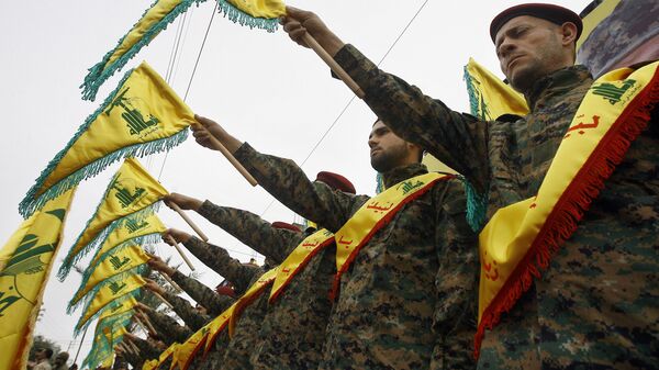 Militantes do grupo xiita libanês Hezbollah - Sputnik Brasil