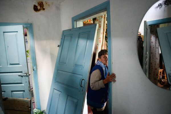 Moradora do povoado Pavlovka destruído na sequência do incêndio nos armazéns com munições em Kalinovka - Sputnik Brasil
